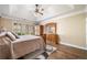Spacious bedroom with decorative ceiling, hardwood floors, ceiling fan, and a decorative rug at 548 Lawton Bridge Sw Rd, Smyrna, GA 30082