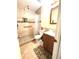 Compact bathroom featuring a walk-in shower with tile and a vanity sink at 5687 Pine Meadow Ct, Morrow, GA 30260