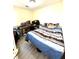 Modest bedroom with wood-look flooring and filled with many items at 5687 Pine Meadow Ct, Morrow, GA 30260