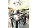 Stylish kitchen with an island and adjacent dining table, ideal for meals and gatherings at 5687 Pine Meadow Ct, Morrow, GA 30260
