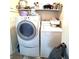 Functional laundry room with a washer and dryer, providing convenience for daily chores at 5687 Pine Meadow Ct, Morrow, GA 30260