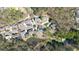 Aerial view showing the houses in the neighborhood and the community pond at 2376 Massey Ln, Decatur, GA 30033