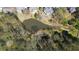 Aerial view of pond surrounded by mature trees and other natural features at 2376 Massey Ln, Decatur, GA 30033
