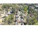 Aerial view of neighborhood showing houses, pond, and wooded areas at 2376 Massey Ln, Decatur, GA 30033