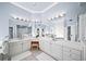 Bright bathroom features dual vanities, modern lighting, and large mirrors creating an open feel at 2376 Massey Ln, Decatur, GA 30033