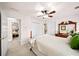 Relaxing bedroom with a neutral color scheme, a ceiling fan, and access to other rooms at 2376 Massey Ln, Decatur, GA 30033