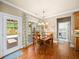 Charming dining area with hardwood floors and a door leading to the outdoor patio at 2376 Massey Ln, Decatur, GA 30033