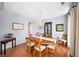 Formal dining room with elegant chandelier, wainscoting and hardwood floors at 2376 Massey Ln, Decatur, GA 30033