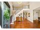 Grand foyer featuring hardwood floors, a staircase, and a chandelier at 2376 Massey Ln, Decatur, GA 30033