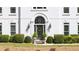 Close-up of the home's front entrance, featuring a decorative door and manicured landscaping at 2376 Massey Ln, Decatur, GA 30033