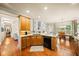 Bright kitchen boasts wooden cabinetry, granite countertops, and stainless steel appliances at 2376 Massey Ln, Decatur, GA 30033