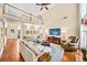 Open-concept living area featuring a vaulted ceiling, a fireplace, and comfortable seating at 2376 Massey Ln, Decatur, GA 30033