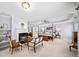 Large main bedroom featuring a sitting area, fireplace, and four-poster bed at 2376 Massey Ln, Decatur, GA 30033