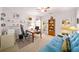 Bright office with a ceiling fan, built-in shelves, and a comfortable futon at 2376 Massey Ln, Decatur, GA 30033
