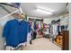 Large walk-in closet with clothing racks, shelves, and organized storage at 2376 Massey Ln, Decatur, GA 30033