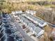 A nice aerial view of the townhome community with ample parking surrounded by a wooded area at 258 Venture Path, Hiram, GA 30141
