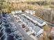 Aerial view of a townhome community with ample parking and mature trees at 258 Venture Path, Hiram, GA 30141