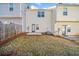 Townhome backyard featuring a small patio area and grassy space at 258 Venture Path, Hiram, GA 30141