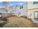Townhome backyard featuring a small patio area and grassy space at 258 Venture Path, Hiram, GA 30141