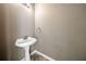 Half bathroom featuring a modern vanity, decorative lighting, and neutral wall colors at 258 Venture Path, Hiram, GA 30141
