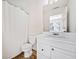 Well-lit bathroom featuring a single vanity with a large mirror and a shower with curtain at 258 Venture Path, Hiram, GA 30141