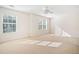 Sun-filled bedroom with two windows, neutral carpet, and a ceiling fan at 258 Venture Path, Hiram, GA 30141