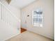 Bright entryway with staircase, plush carpet, and large window that allows natural light at 258 Venture Path, Hiram, GA 30141