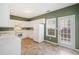 Eat-in kitchen with white cabinets, vinyl flooring, and a full appliance package at 258 Venture Path, Hiram, GA 30141