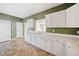 Eat-in kitchen featuring ample counter space, and a doorway leading to the main living space at 258 Venture Path, Hiram, GA 30141