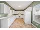 Well-lit kitchen with modern appliances, ample counter space, and white cabinetry at 258 Venture Path, Hiram, GA 30141