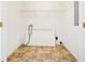 Efficient laundry room area with essential hookups and flooring at 258 Venture Path, Hiram, GA 30141