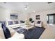 Spacious living room with plush seating, neutral colors, and ceiling fan at 258 Venture Path, Hiram, GA 30141