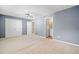 Spacious main bedroom featuring a ceiling fan, plush carpeting, and en-suite bathroom at 258 Venture Path, Hiram, GA 30141