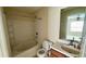 Well lit bathroom featuring a shower and bathtub combination with modern fixtures and vanity at 5204 Waldrop, Decatur, GA 30034
