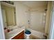 This bright bathroom features a shower and tub combination, a sink, toilet, and vanity area at 5204 Waldrop, Decatur, GA 30034