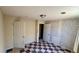 Checkered tile bedroom with neutral walls and a textured brick wall offering style and a unique look at 5204 Waldrop, Decatur, GA 30034