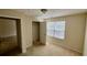 This bedroom has neutral walls, a window, a ceiling light, and a closet for storage and organization at 5204 Waldrop, Decatur, GA 30034