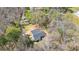 Aerial view of a charming home nestled among mature trees on a spacious lot at 528 Lower Scott Mill Rd, Canton, GA 30114