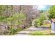 Scenic driveway leading to the property, surrounded by lush trees and natural landscape at 528 Lower Scott Mill Rd, Canton, GA 30114