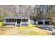 Charming home featuring a screened porch, detached garage, and a peaceful, wooded lot at 528 Lower Scott Mill Rd, Canton, GA 30114