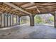 Spacious garage interior featuring an open layout, concrete floor, and natural light at 528 Lower Scott Mill Rd, Canton, GA 30114