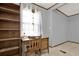 Home office space featuring a wooden desk and bookshelf with natural light at 528 Lower Scott Mill Rd, Canton, GA 30114