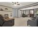 Comfortable living room featuring a white brick fireplace and neutral-toned furniture on carpet at 528 Lower Scott Mill Rd, Canton, GA 30114