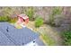 Aerial view of an outbuilding with a red exterior and metal roof on a wooded lot at 528 Lower Scott Mill Rd, Canton, GA 30114