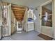 View of the open and spacious porch of the home with a screen door and wooded surroundings at 528 Lower Scott Mill Rd, Canton, GA 30114