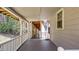 Spacious porch with a railing, providing an excellent view of the lush wooded surroundings at 528 Lower Scott Mill Rd, Canton, GA 30114