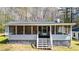 Inviting screened porch perfect for relaxation and enjoying outdoor views. Has stairs for easy access at 528 Lower Scott Mill Rd, Canton, GA 30114