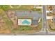 This aerial view shows a pool, parking, and playground in a well-maintained residential community at 822 Pine Way, Dallas, GA 30157