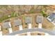 Aerial view of single-Gathering homes with gray roofs, driveways, and manicured lawns at 822 Pine Way, Dallas, GA 30157