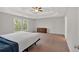 Spacious bedroom with trey ceiling, carpet flooring and a view from the window at 822 Pine Way, Dallas, GA 30157